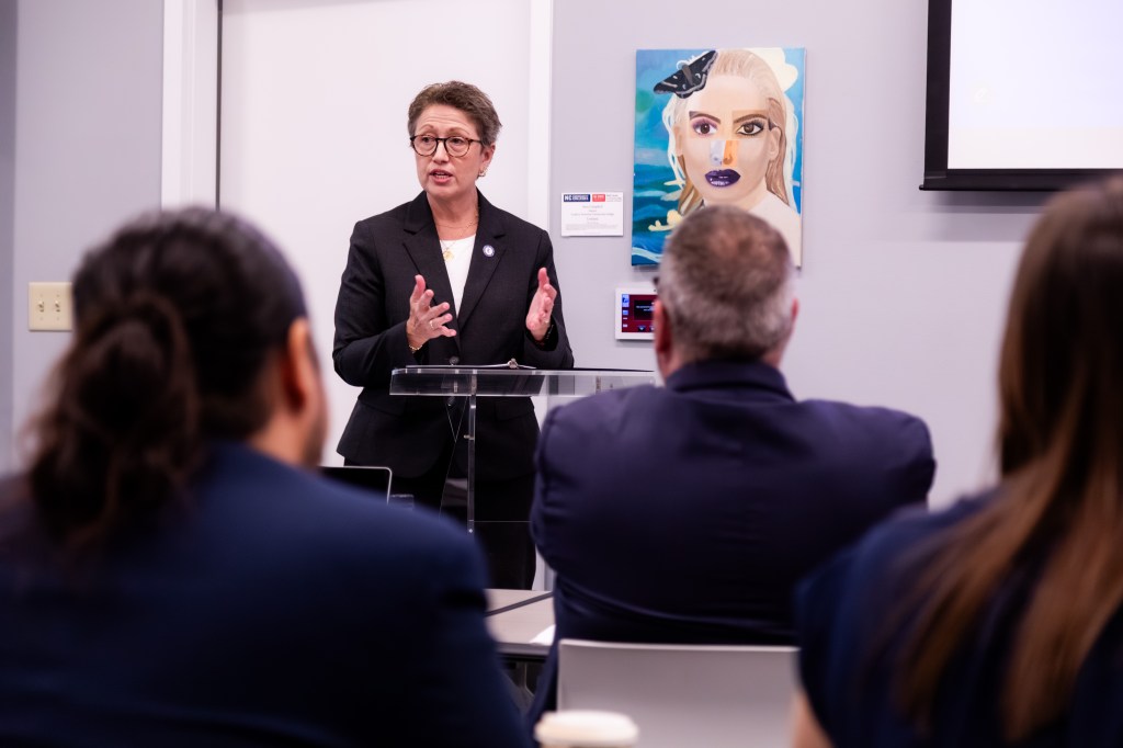 Dr. Jaeger speaking to an audience at the Belk Center.