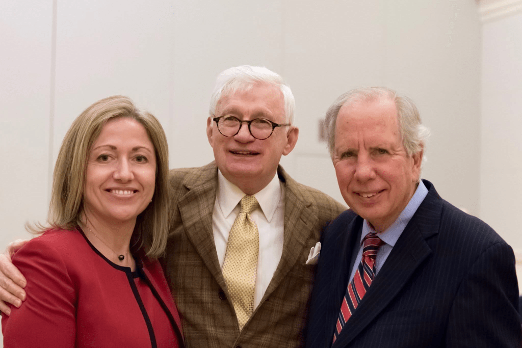 Dr. AJ Jaeger standing with Dr. Robert Templin and another colleague.